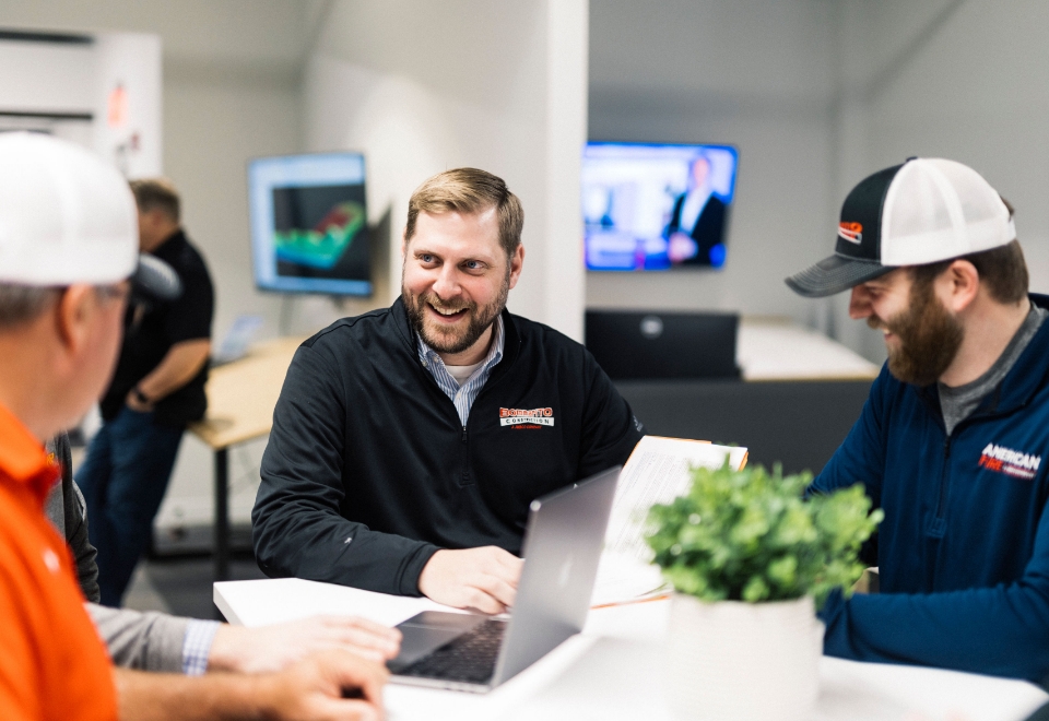 Team Reviewing Monitor