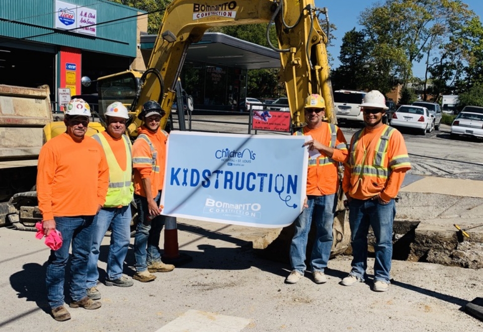 Construction Crew Holding KIDstruction Sign