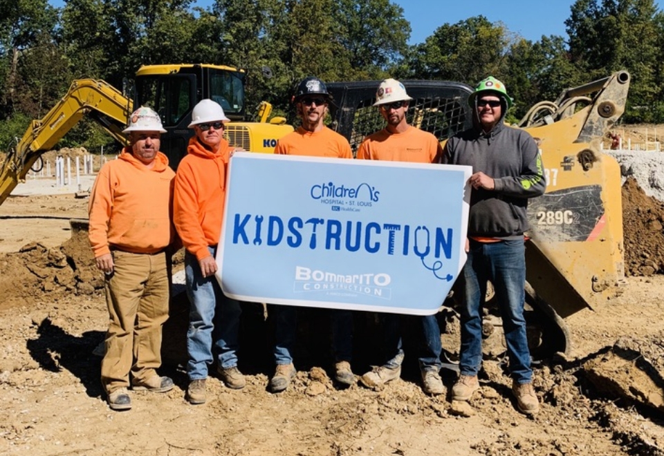 Crew Holding Kidstruction Sign